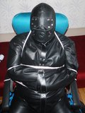 Chairtied in straitjacket