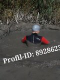 Outdoor in Wetsuit covered in Thick mud