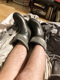 Sweaty black socks and  rubber boots