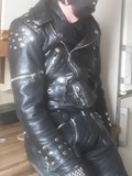 horny in padded pants and studded leather jacket