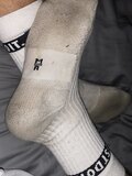 Man in dirty white crew socks
