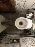Dirty feet on toilet