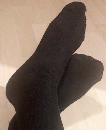 My feet in black socks