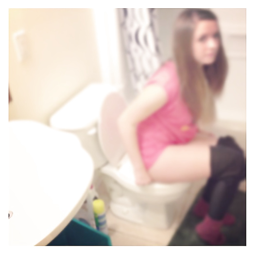 Beautiful Girls sitting on toilet