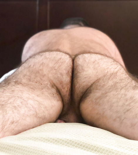 Asses of men lying and resting