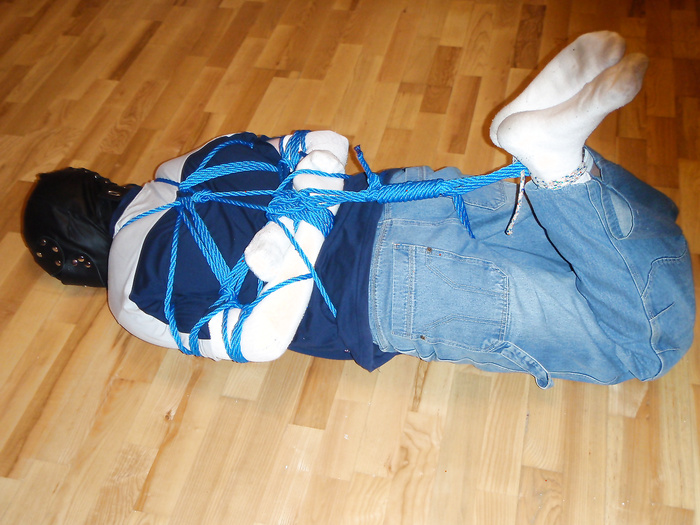 Hogtied and straitjacketed