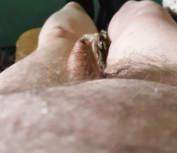 Laying naked, on my back, pissing myself.