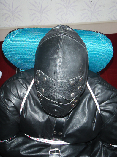 Chairtied in straitjacket