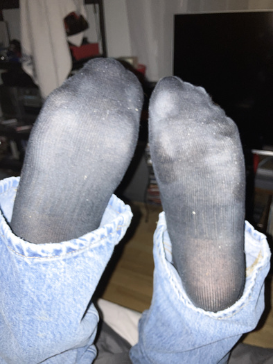 Sweaty black socks and  rubber boots