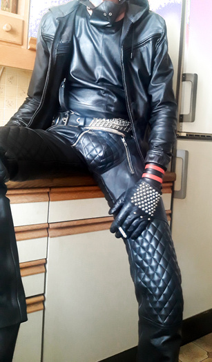 horny in padded pants and leather hoodie