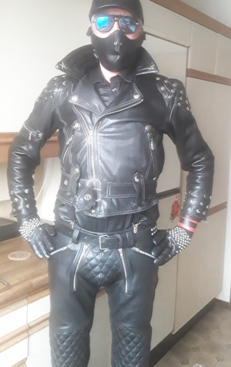 horny in padded pants and studded leather jacket