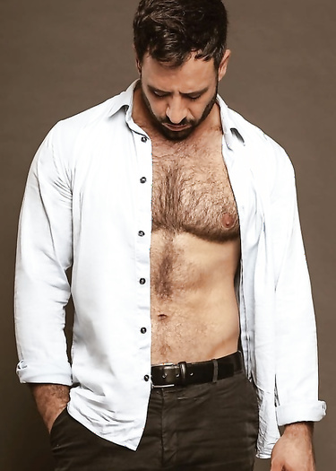 Hairy chest exposed under shirt