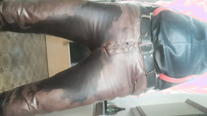 white PVC jacket and brown pissed leather pants