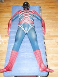 Spiderman is tied and muzzled