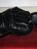 In a leather straitjacket