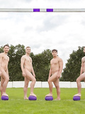 Fit rugby lads feet on a purple rugby balls
