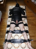 Restrained in a neoprene bondage suit