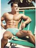 Muscular young men on the beach