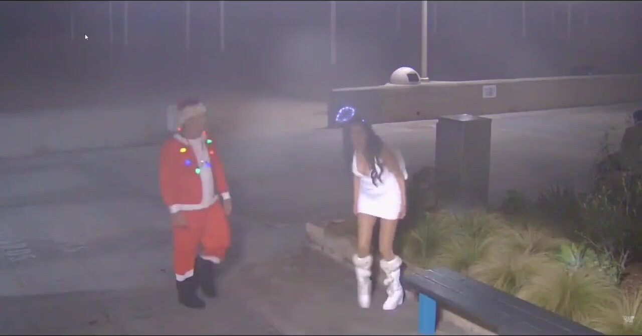 Santa watches over his woman peeing outside