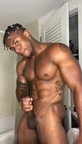 black muscular hung dude beats off