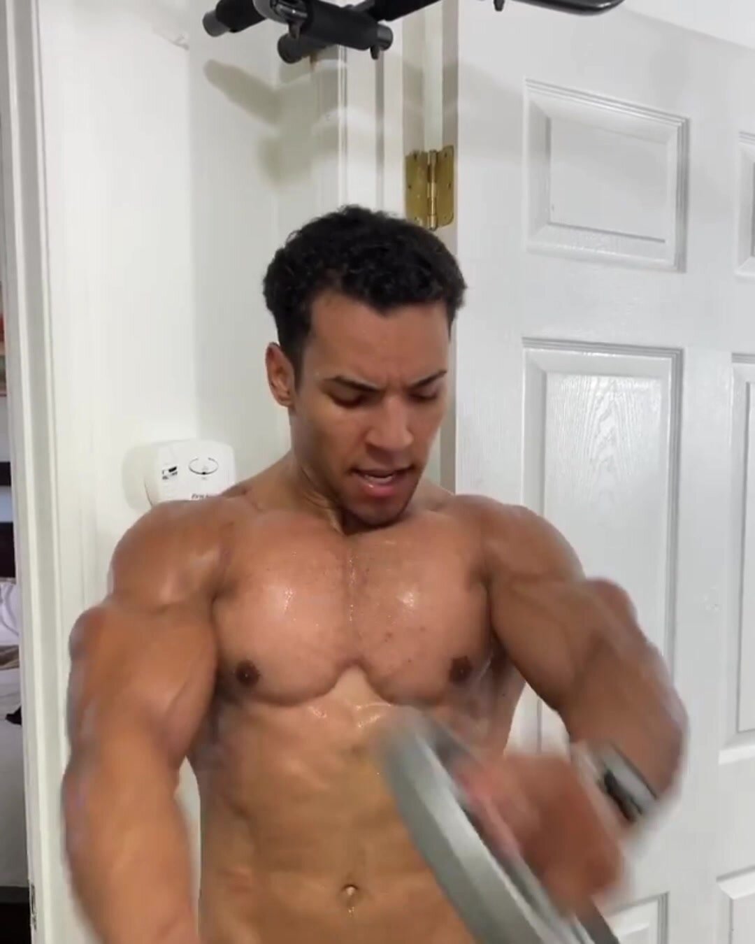 Sexy Sweaty Bodybuilder Working Out and Flexing