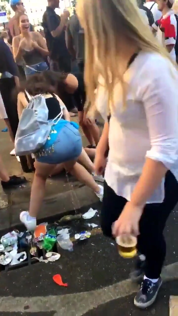 Teen urinates on garbage on corner of crowded street