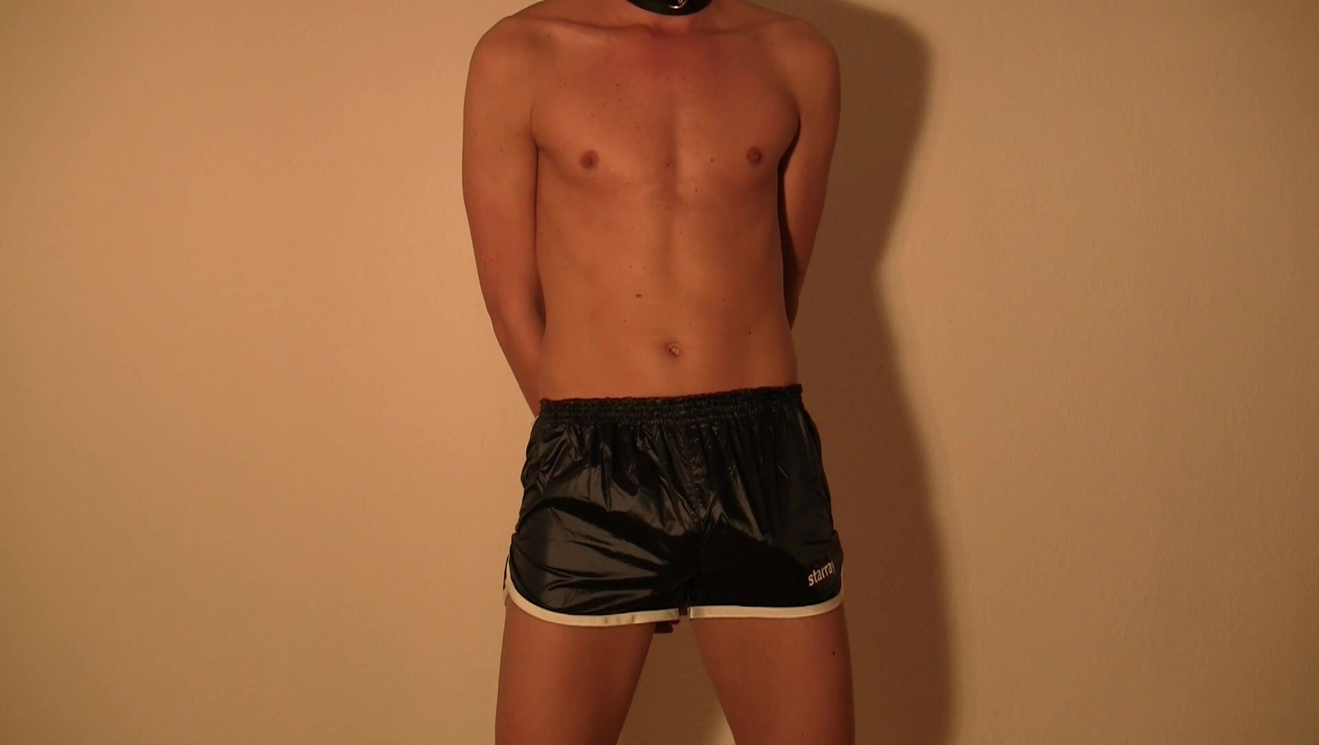 Shiny shorts handcuffs and helping hands