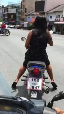 Thai girl hard revving fun at traffic stop