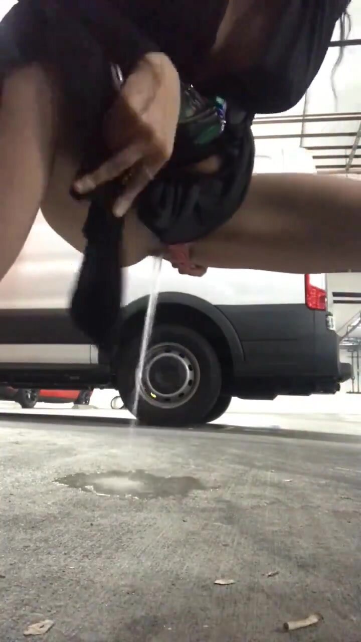 Cutie films flooding the parking garage next to a van
