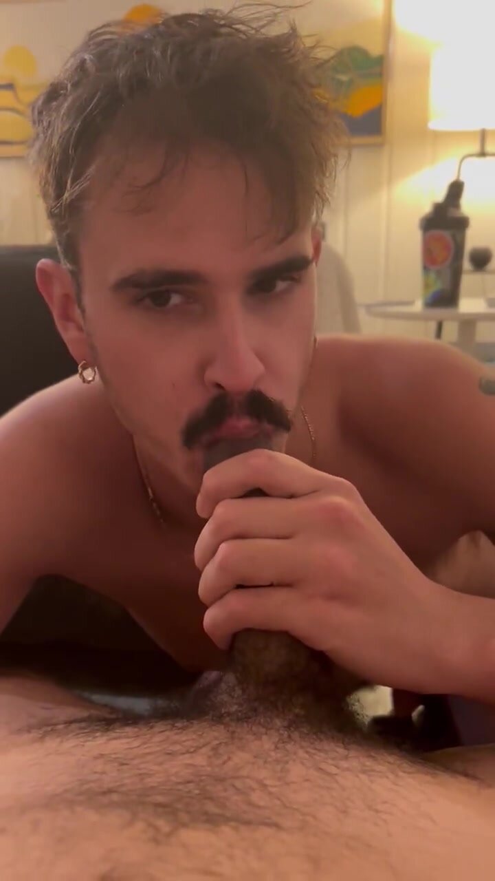Playing with and sucking on the foreskin of uncut cock