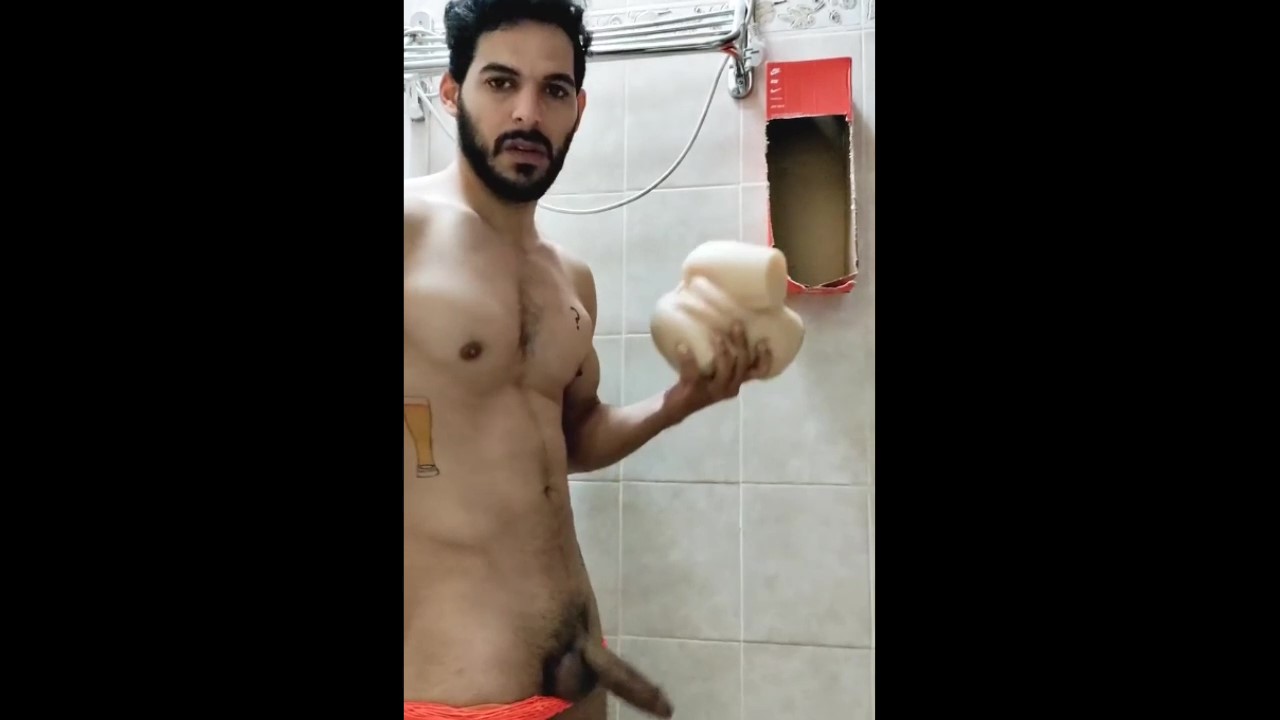 Sexy bearded hunk pounding a rubber toy