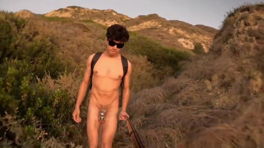 locked & plugged twunk walks naked on the beach