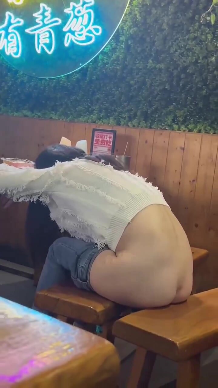 Asian customer caught pissing between restaurants bench