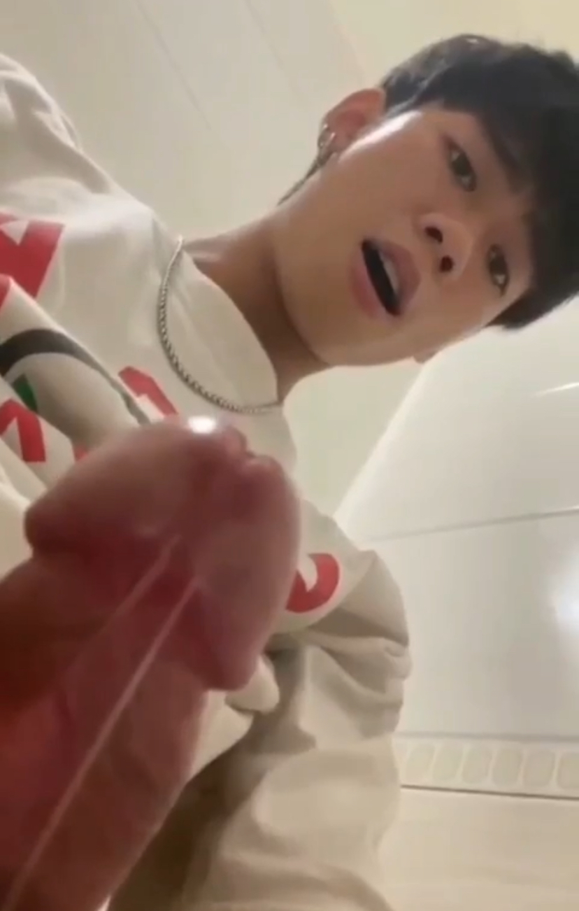 Asian guy jerks his big cock