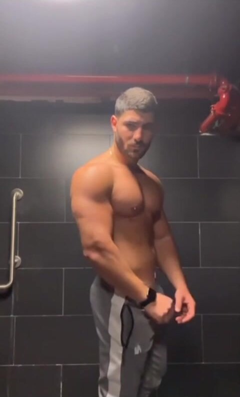 hot guy showing off his body
