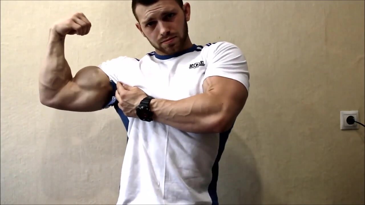 Fit guy flexing and ripping shirt