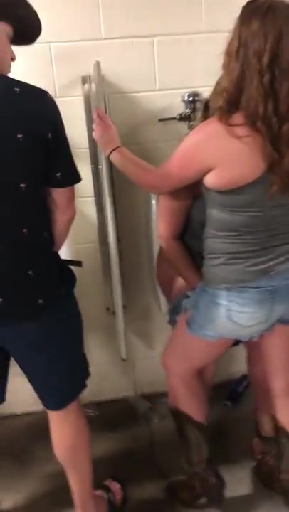 Girl using Urinal