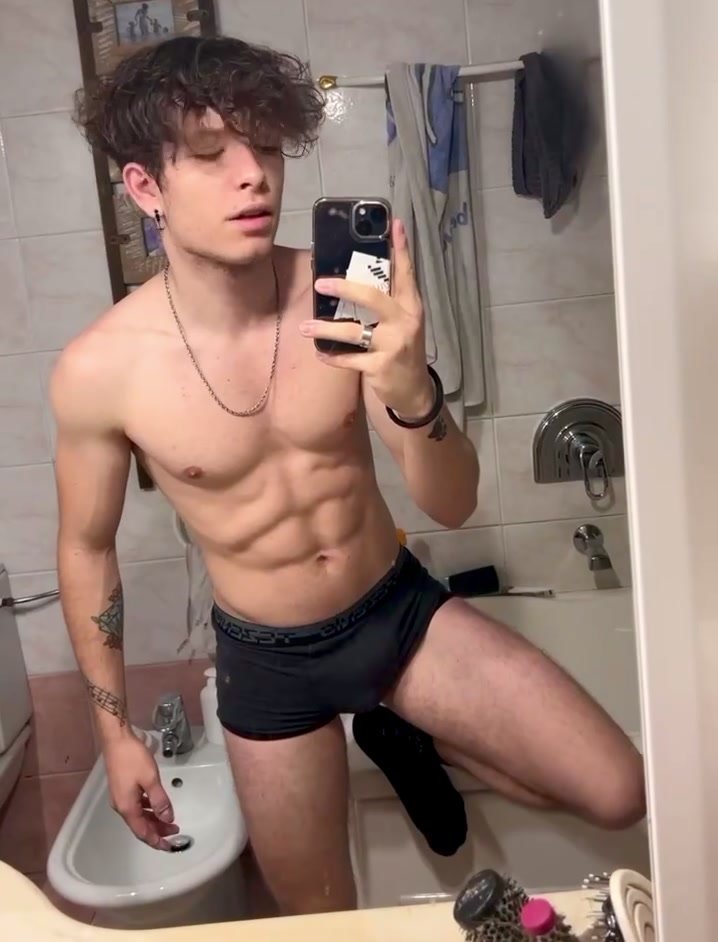 Sexy man showing abs and bulge