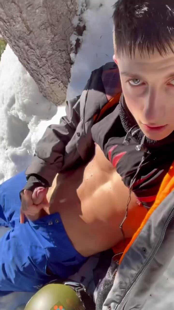 Muscular guy jerks off outside in the snow and cums