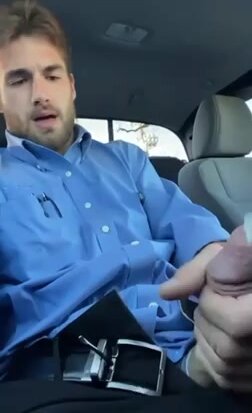 handsome bearded guy jerks off and cums in his car