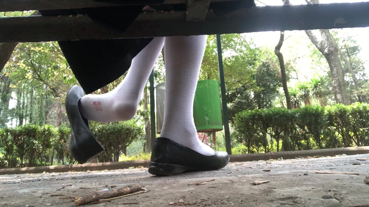 Flats shoeplay under bench at park