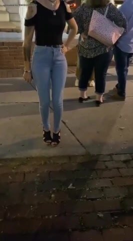 She pees her jeans in front of a group of people.