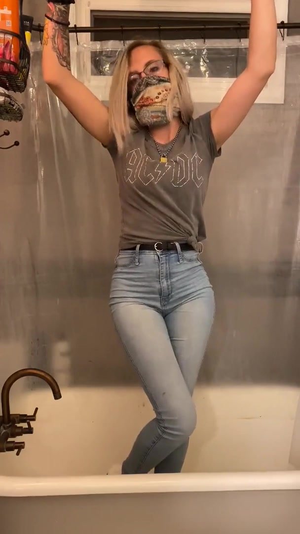 Girl tied up pees her jeans