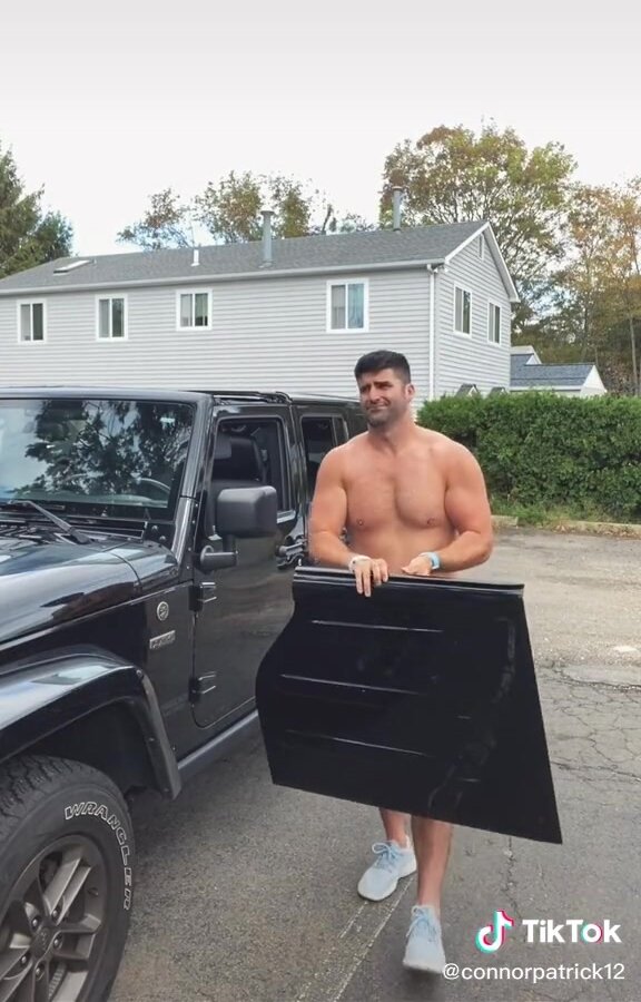 Muscular nurse transforming his jeep