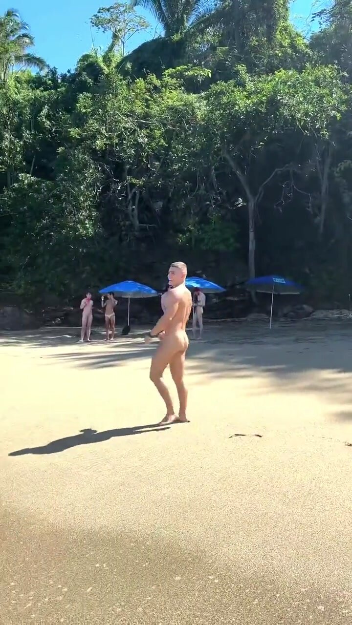 cute gay twink naked on the beach