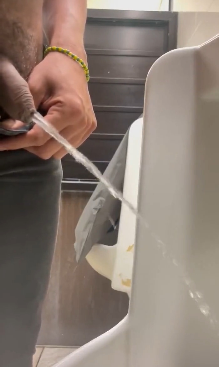 Uncut guy caught peeing at urinals