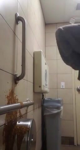 Girl squirts diarrhea on the wall