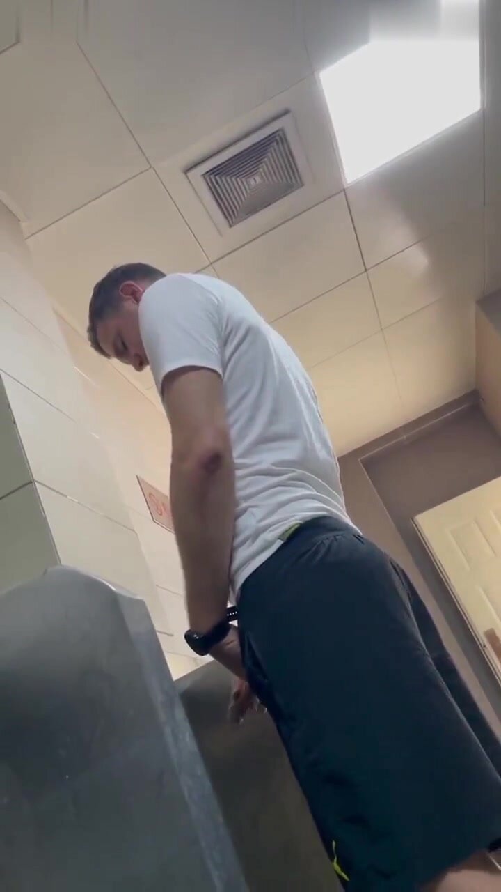 Tall uncut guy at the urinal