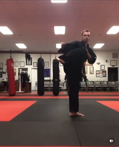 black belt kick in uniform