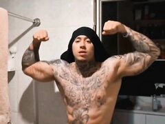 muscular tatted-up latino naked showing big thick cock